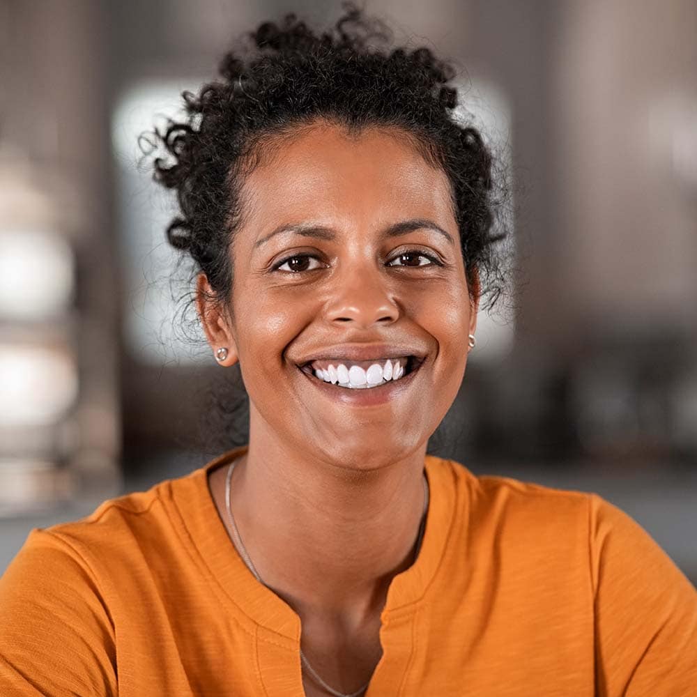 portrait of happy african woman smiling ZFMZCSC